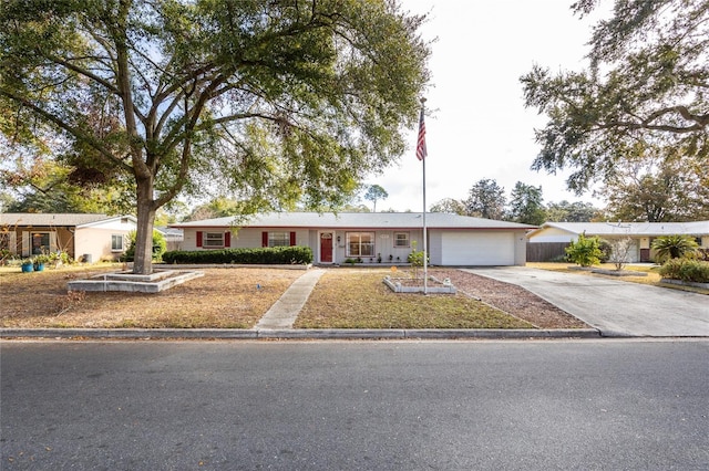 single story home featuring a garage