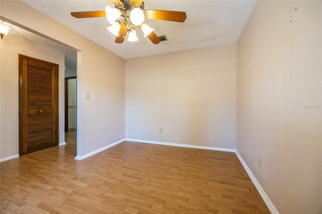 unfurnished room featuring ceiling fan and light wood-type flooring