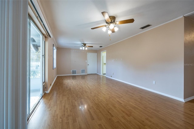 unfurnished room with hardwood / wood-style flooring, ceiling fan, and ornamental molding