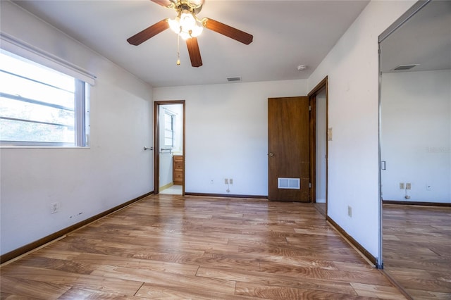 unfurnished bedroom with hardwood / wood-style flooring and ceiling fan