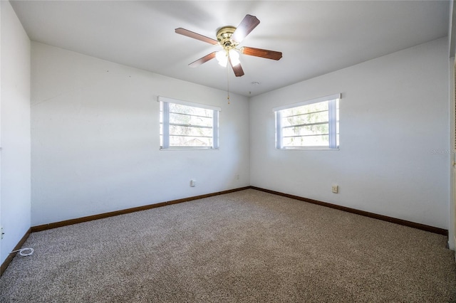 spare room featuring carpet floors and ceiling fan