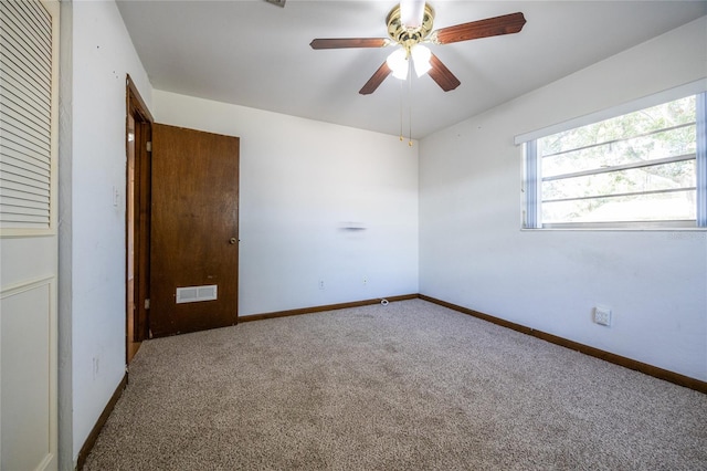 unfurnished bedroom with carpet flooring, ceiling fan, and a closet