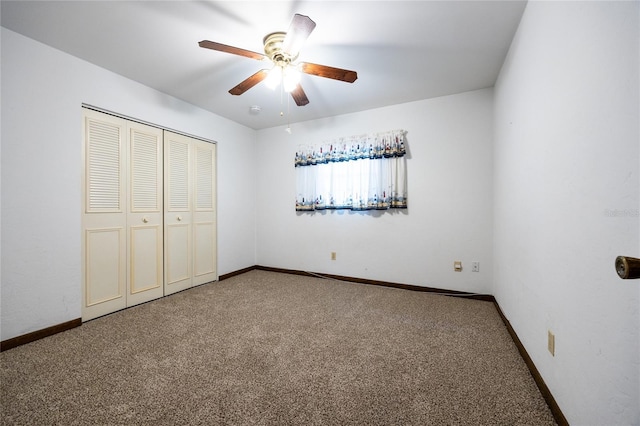 unfurnished bedroom with carpet flooring, ceiling fan, and a closet