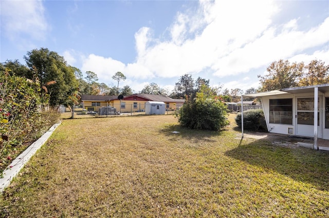 view of yard with a sunroom