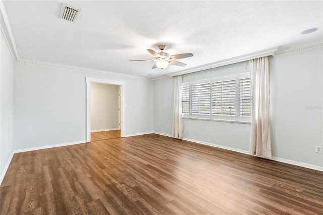 unfurnished room featuring dark hardwood / wood-style floors, ceiling fan, and ornamental molding