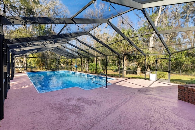 view of pool featuring a lanai and a patio