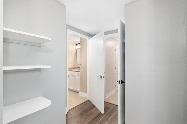 corridor featuring wood-type flooring