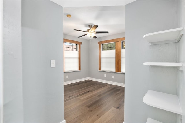 unfurnished room featuring ceiling fan and hardwood / wood-style floors