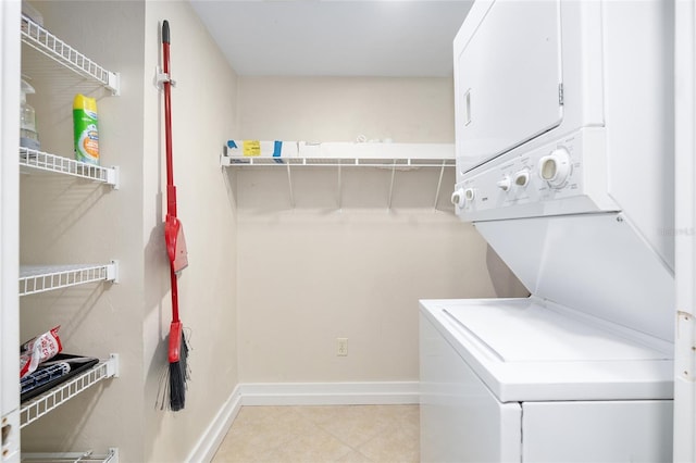 laundry area featuring stacked washing maching and dryer