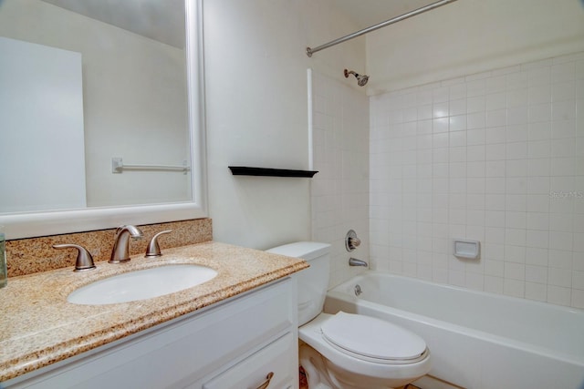 full bathroom featuring vanity, toilet, and tiled shower / bath combo