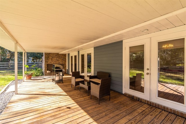 wooden deck featuring french doors