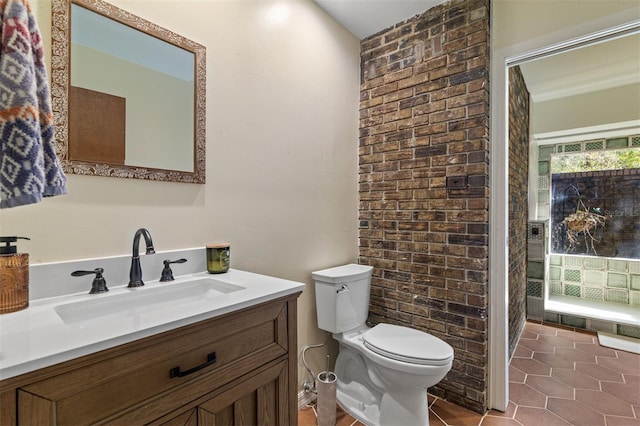 bathroom featuring toilet, vanity, and tile patterned floors