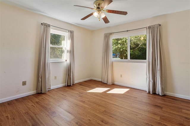 unfurnished room with light hardwood / wood-style flooring and ceiling fan