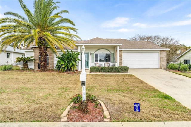 view of front of property with a garage, covered porch, and a front lawn