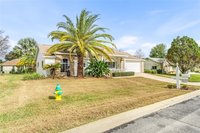 view of front of home featuring a front lawn and a garage