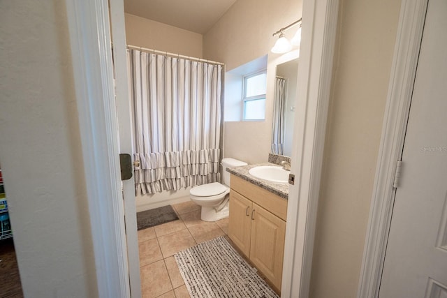 full bathroom with tile patterned flooring, vanity, toilet, and shower / tub combo with curtain