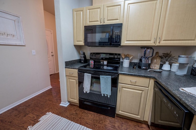 kitchen featuring dark hardwood / wood-style flooring and black appliances