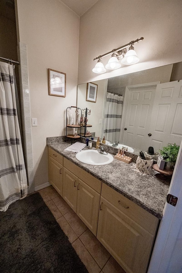 bathroom featuring tile patterned floors and vanity