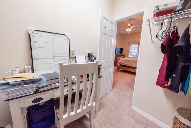 office area with ceiling fan and light colored carpet