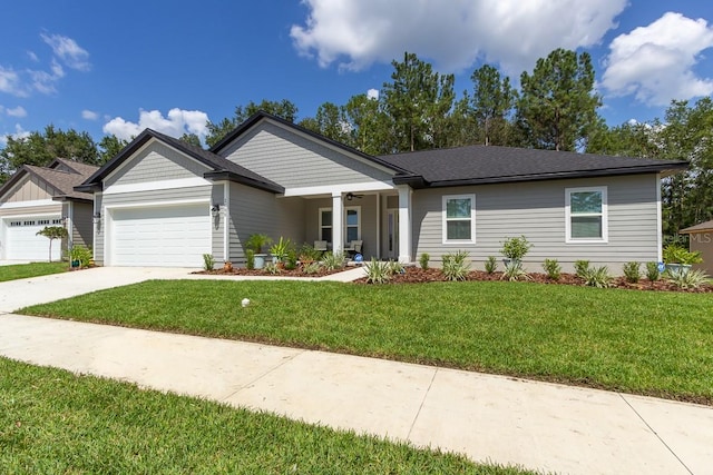 ranch-style house with a garage and a front lawn