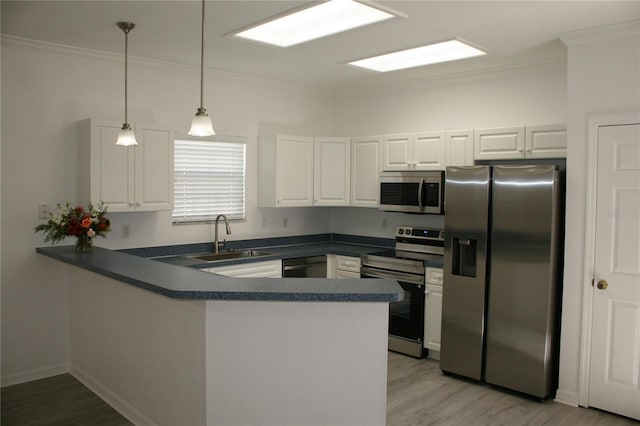 kitchen featuring kitchen peninsula, white cabinetry, sink, and stainless steel appliances