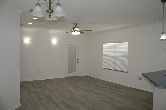 interior space featuring dark hardwood / wood-style flooring, ceiling fan, and crown molding