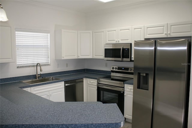 kitchen with white cabinetry, sink, ornamental molding, and appliances with stainless steel finishes