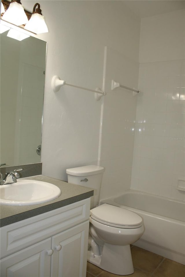 full bathroom featuring tile patterned floors, vanity, toilet, and bathtub / shower combination