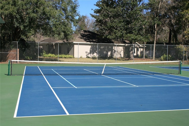 view of tennis court featuring basketball court