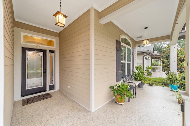 entrance to property with covered porch