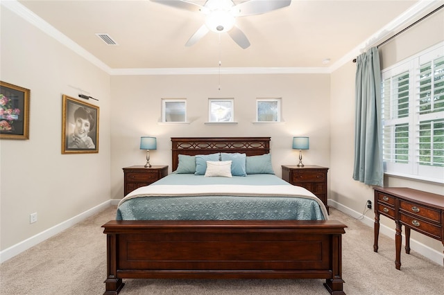 carpeted bedroom with crown molding and ceiling fan