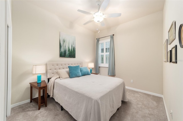 bedroom featuring ceiling fan and light carpet