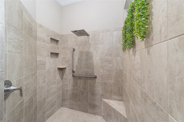 bathroom with tiled shower