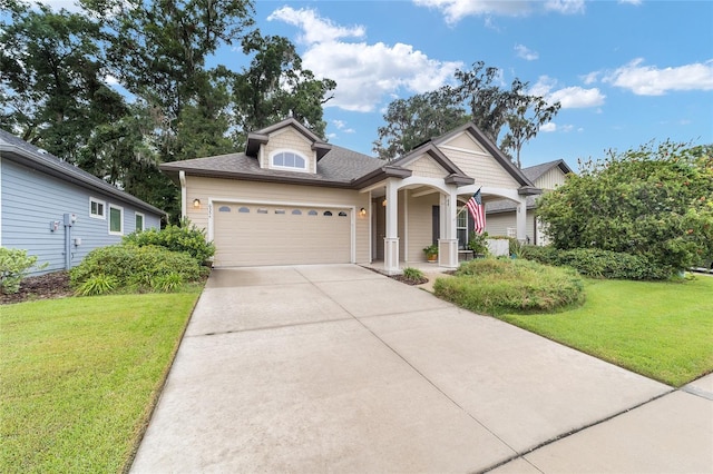 view of front of house with a garage and a front yard