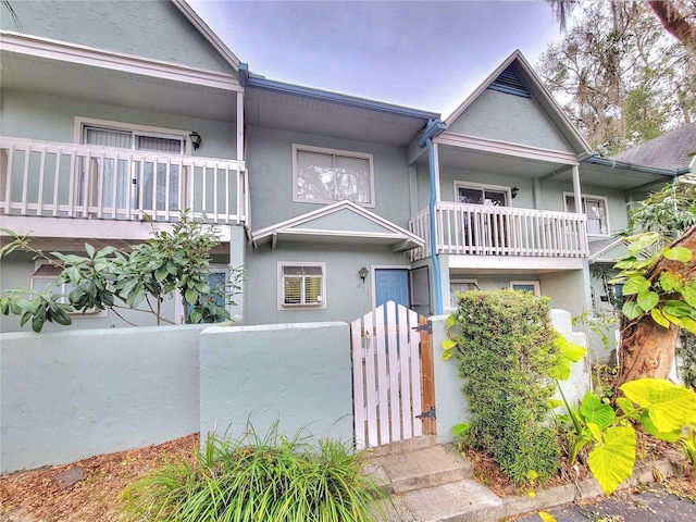 view of front of property with a balcony