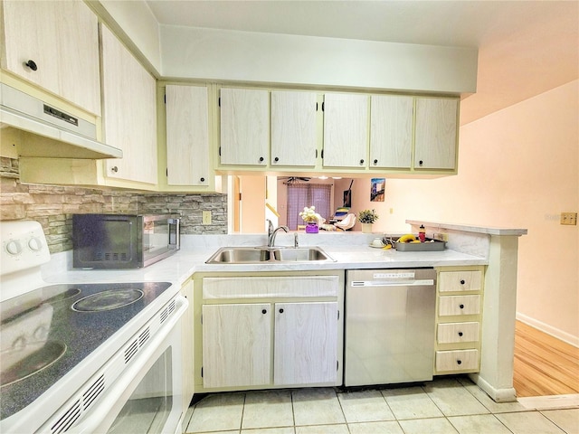 kitchen with sink, stainless steel dishwasher, white range with electric stovetop, and light tile patterned floors