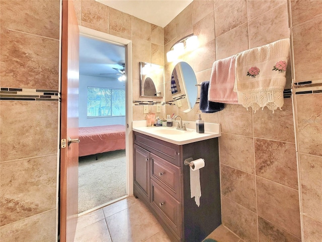 bathroom featuring vanity, tile patterned flooring, and ceiling fan