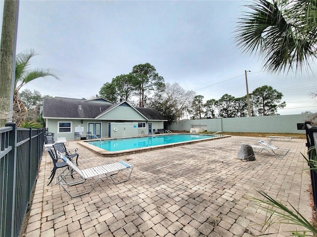 view of swimming pool with a patio