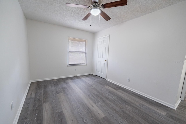 empty room with a textured ceiling, ceiling fan, and dark wood-type flooring