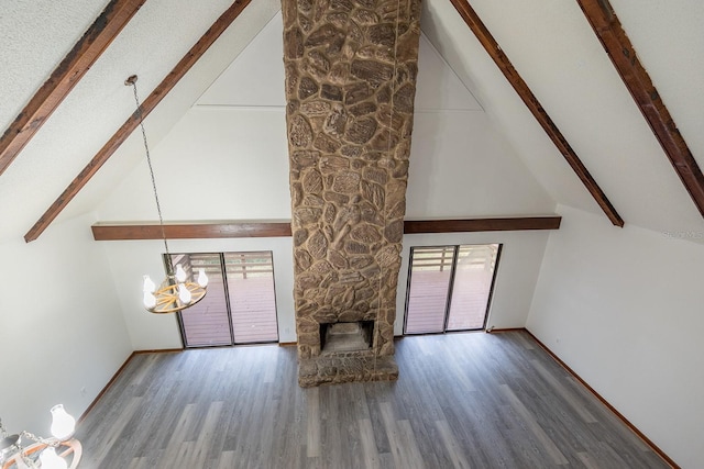 unfurnished living room with beam ceiling, high vaulted ceiling, and a notable chandelier