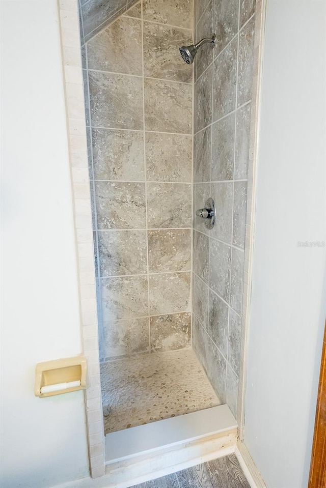 bathroom with a tile shower