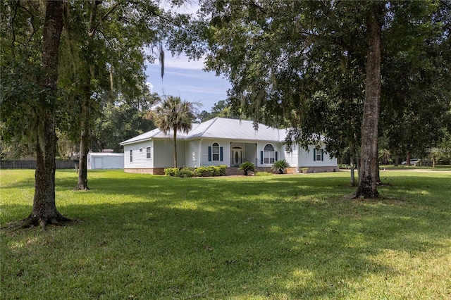 ranch-style house featuring a front lawn