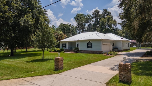 single story home with a front yard and a garage