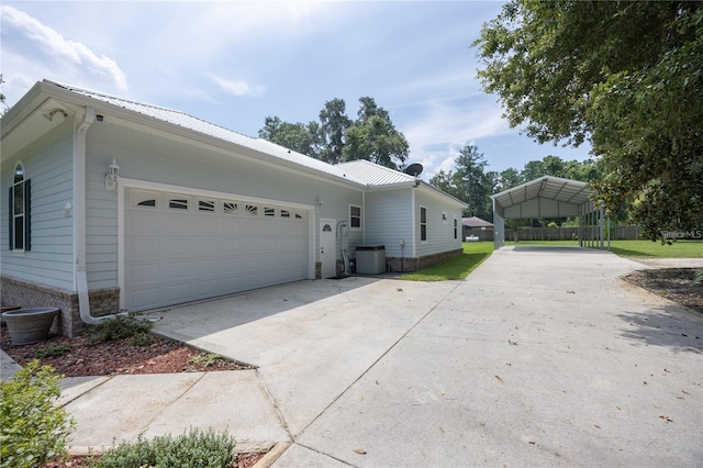 view of front facade featuring a garage and a carport