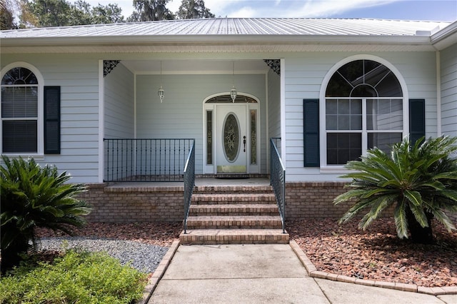 view of exterior entry featuring a porch