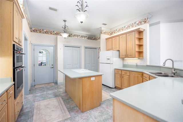 kitchen with sink, white refrigerator with ice dispenser, pendant lighting, light brown cabinets, and a kitchen island