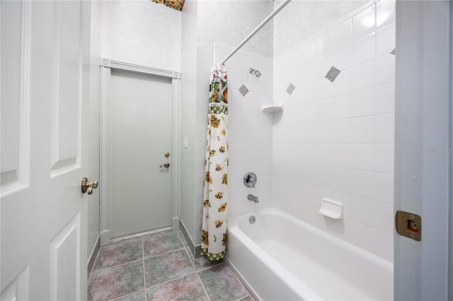 bathroom with shower / bath combination with curtain