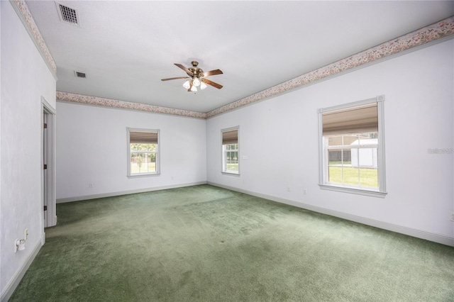 carpeted empty room featuring ceiling fan