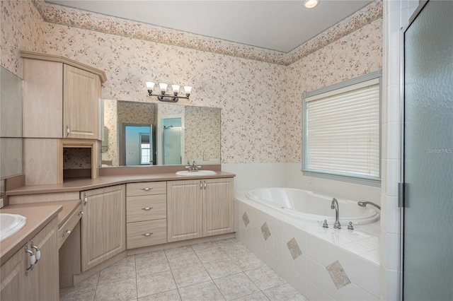 bathroom featuring tile patterned flooring, shower with separate bathtub, vanity, and a notable chandelier