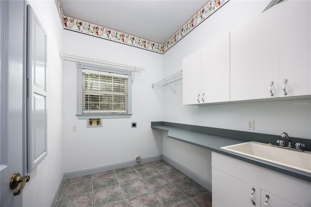 laundry area with cabinets, sink, washer hookup, and hookup for an electric dryer